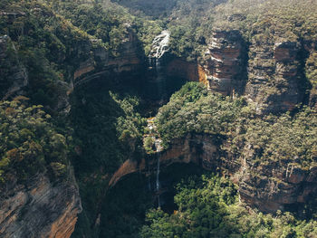 High angle view of sun shining through rocks