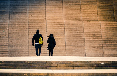 Men walking on zebra crossing