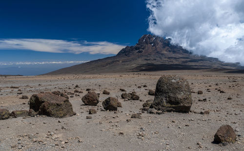 Panoramic view of arid landscape against sky