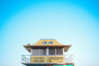 Low angle view of built structure against clear blue sky