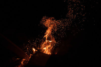 Burning fire at night outdoors