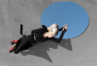 High angle view of woman reflecting on mirror