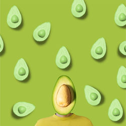 Man face covered with avocado against green background