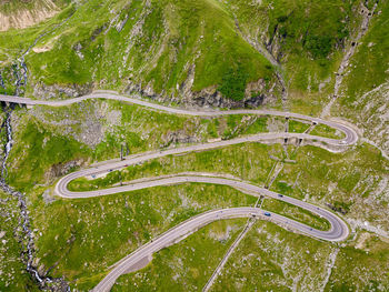 High angle view of winding road amidst plants