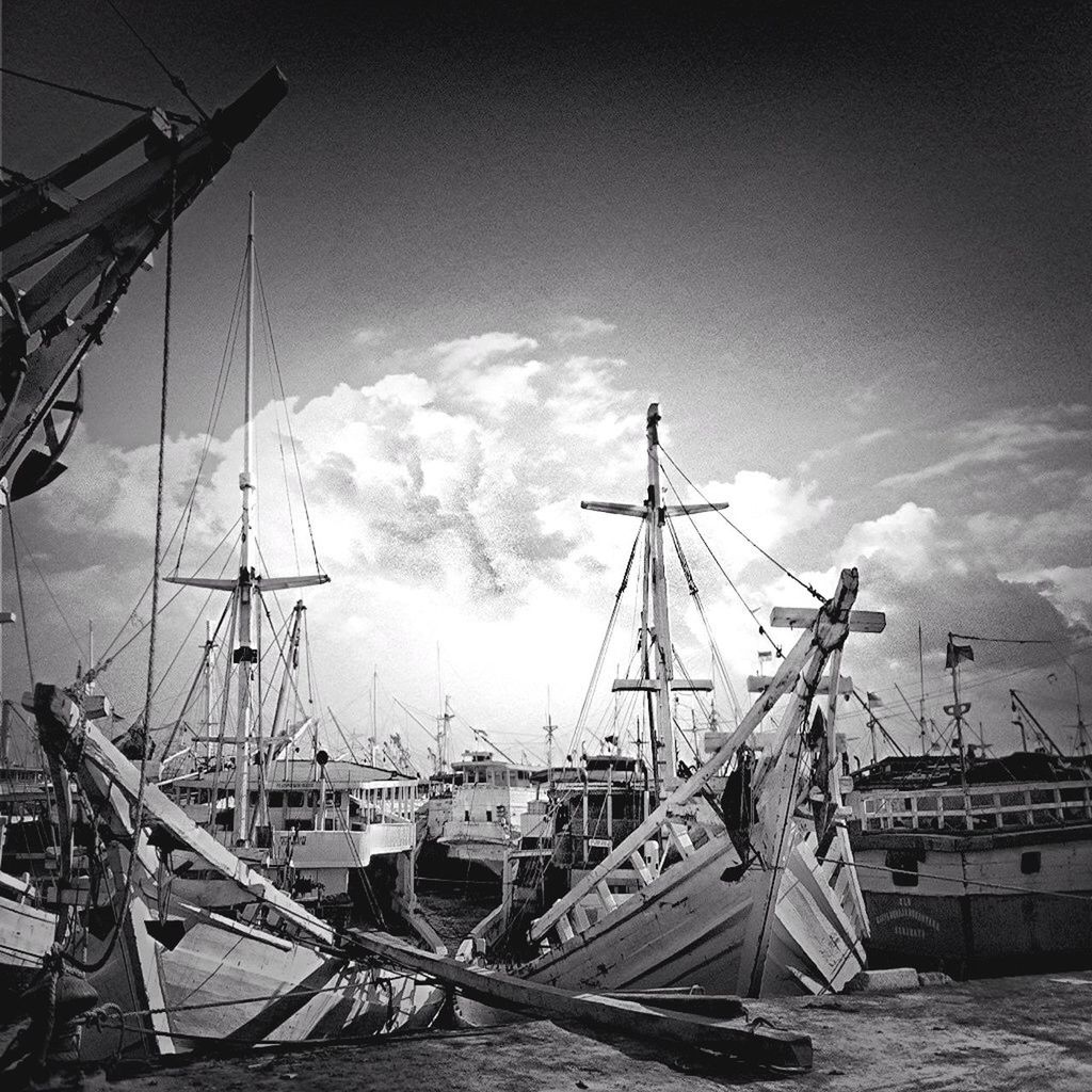 transportation, nautical vessel, mode of transport, mast, boat, sky, moored, harbor, cloud - sky, ship, crane - construction machinery, travel, commercial dock, water, freight transportation, sailboat, outdoors, day, sea, no people