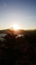 Scenic view of silhouette landscape against sky at sunset