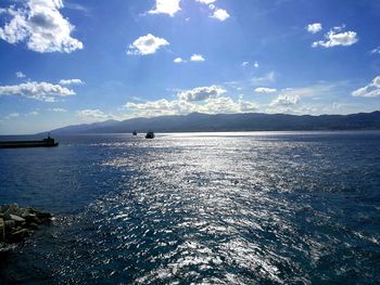 Scenic view of sea against cloudy sky