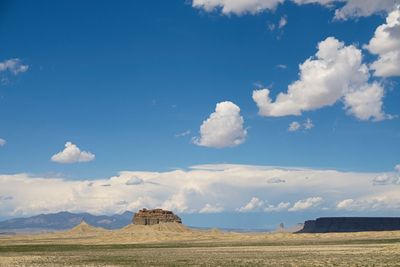 Scenic view of landscape against cloudy sky