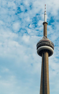 Low angle view of communications tower against sky