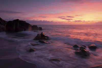 Scenic view of sea against dramatic sky