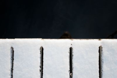 Snow covered edge of a pier and the baltic sea