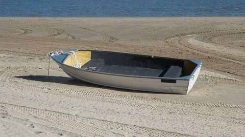 High angle view of boat moored on beach