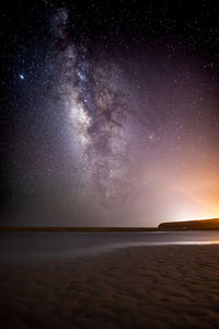 Scenic view of sea against sky at night