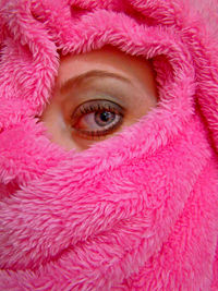 Close-up of woman looking away while wrapped in towel