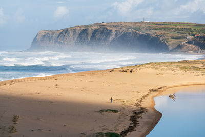 Scenic view of beach against sky