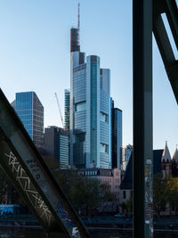 Modern buildings in city against clear sky