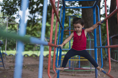 Full length of young woman exercising in park