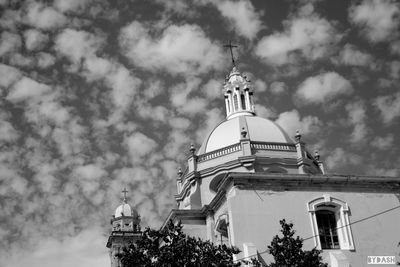 Low angle view of built structure against cloudy sky