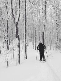 People walking on snow covered landscape