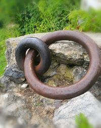 Close-up of rusty metal on rock