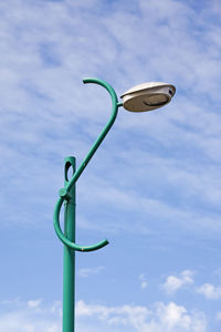 Low angle view of street light against sky