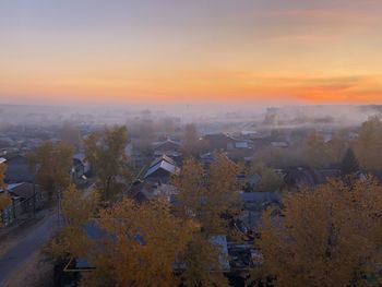 High angle view of townscape against sky during sunset