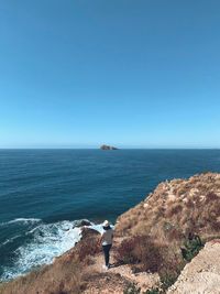 Scenic view of sea against clear blue sky