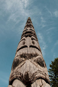 Low angle view of totem against sky
