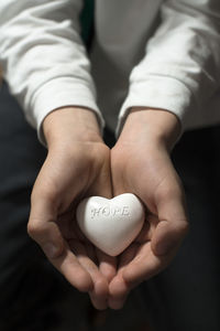 Close-up of hands holding heart shape