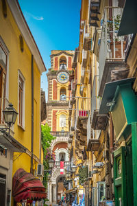 Low angle view of buildings against blue sky