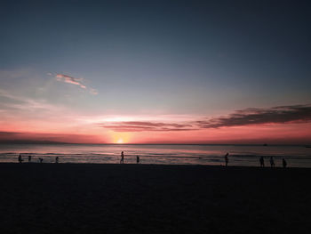 Scenic view of beach against sky during sunset