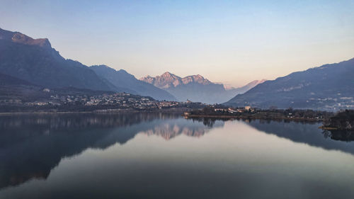 Scenic view of lake and mountains against sky