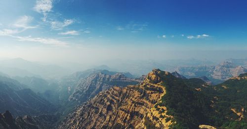 Scenic view of mountains against sky during sunset