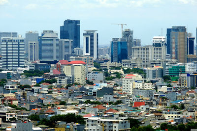 High angle view of buildings in city against sky