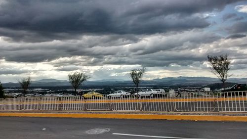 Road against cloudy sky