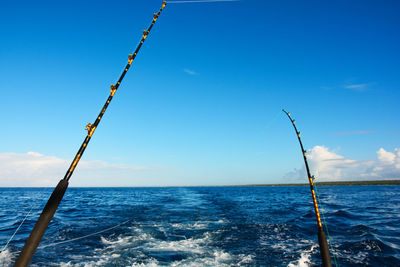 Scenic view of sea against blue sky