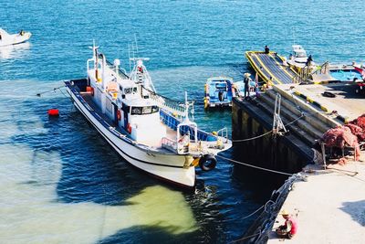 High angle view of boats moored at harbor