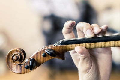 Close-up of hand playing violin