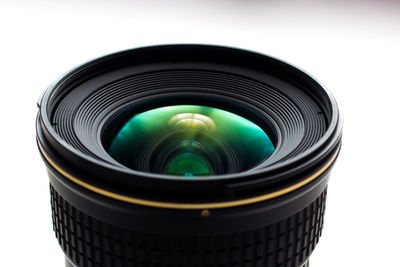 Close-up of lens over white background