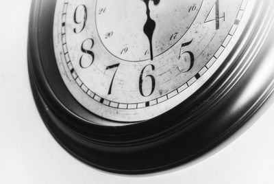 Close-up of clock against white background