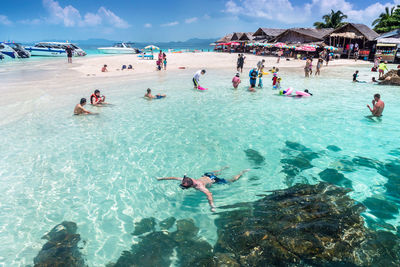 People swimming in sea