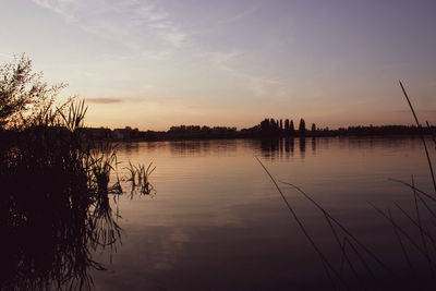 Scenic view of lake against sky during sunset