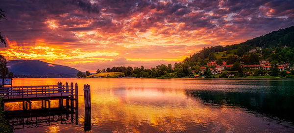 Scenic view of lake against orange sky