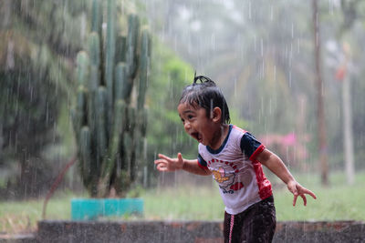 Full length of a man playing in water