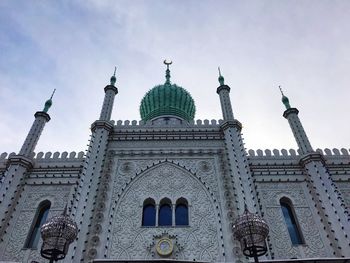 Low angle view of building against cloudy sky