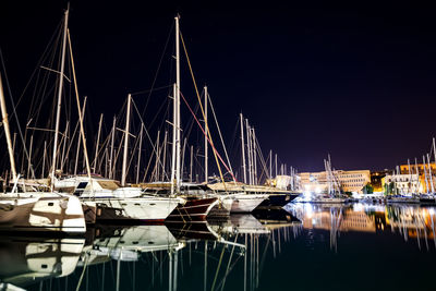 Boats moored at harbor