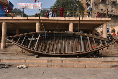 People on boat moored in water