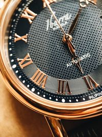 Close-up of clock on table