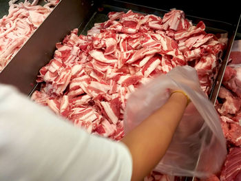 High angle view of person preparing food at market