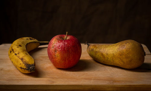 Close-up of fruits on wooden table